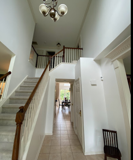 Level 5 smooth-wall finish — flawless two-story foyer walls