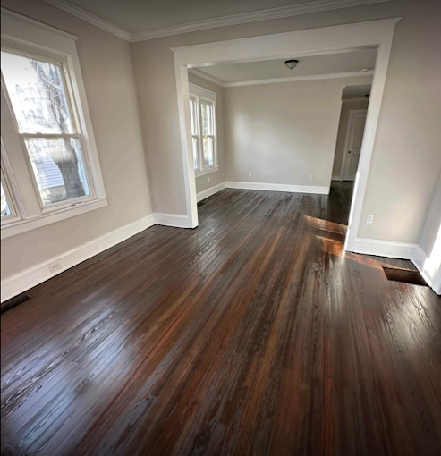 Smooth, skim-coated walls in a freshly refinished room