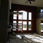 Sunroom with large arched windows, wood trim refinished - fine-finish painting and wood trim refinishing.